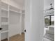 Spacious walk-in closet with built-in shelves and ample storage at 1169 Boundary Blvd, Rotonda West, FL 33947