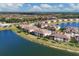 Aerial view of luxury homes surrounding a lake at 12580 Ghiberti Cir # 101, Venice, FL 34293