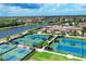 Community tennis courts, pool, clubhouse, and lakefront at 12580 Ghiberti Cir # 101, Venice, FL 34293