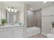 Clean bathroom with white vanity and tub at 12580 Ghiberti Cir # 101, Venice, FL 34293