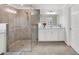 Spa-like bathroom with a large shower and double vanity at 12580 Ghiberti Cir # 101, Venice, FL 34293