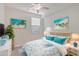 Second bedroom with coastal decor and a comfortable bed at 12580 Ghiberti Cir # 101, Venice, FL 34293