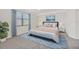 Bright bedroom with a comfortable bed and neutral decor at 12580 Ghiberti Cir # 101, Venice, FL 34293
