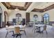 Community room with tables and chairs, perfect for gatherings at 12580 Ghiberti Cir # 101, Venice, FL 34293