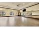 Yoga and exercise room with mirrors and a large screen at 12580 Ghiberti Cir # 101, Venice, FL 34293