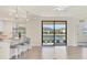 Modern kitchen with white cabinets, stainless steel appliances, and an island at 12580 Ghiberti Cir # 101, Venice, FL 34293