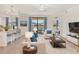 Open living room with a view of the lake and modern furnishings at 12580 Ghiberti Cir # 101, Venice, FL 34293