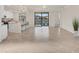 Open concept living area with tile floors and kitchen views at 12580 Ghiberti Cir # 101, Venice, FL 34293