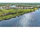 Aerial view of waterfront homes with lush landscaping at 12953 N Marsh Dr, Port Charlotte, FL 33953