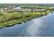 Aerial view showcasing a single home's waterfront location at 12953 N Marsh Dr, Port Charlotte, FL 33953