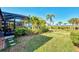 Landscaped backyard with pool and water view at 12953 N Marsh Dr, Port Charlotte, FL 33953