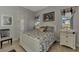 Bedroom with white bed frame and water views at 12953 N Marsh Dr, Port Charlotte, FL 33953