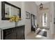 Bright and spacious entryway with tile flooring and a coat rack at 12953 N Marsh Dr, Port Charlotte, FL 33953