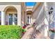 Front entry with double doors and a charming brick patio area at 12953 N Marsh Dr, Port Charlotte, FL 33953