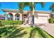 Charming single story home with lush landscaping and paver driveway at 12953 N Marsh Dr, Port Charlotte, FL 33953
