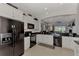 Modern kitchen with a large island and granite countertops at 12953 N Marsh Dr, Port Charlotte, FL 33953