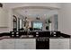 Kitchen with a large island and granite countertops, open to the living room at 12953 N Marsh Dr, Port Charlotte, FL 33953