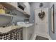Bright laundry room with washer, dryer, and utility sink at 12953 N Marsh Dr, Port Charlotte, FL 33953