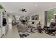 Open concept living room with adjacent kitchen and lots of natural light at 12953 N Marsh Dr, Port Charlotte, FL 33953
