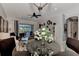 Bright living room with seating area, water view, and glass-top dining table at 12953 N Marsh Dr, Port Charlotte, FL 33953