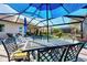 Outdoor patio dining area with seating for six at 12953 N Marsh Dr, Port Charlotte, FL 33953