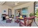 Comfortable patio with wicker furniture and sliding doors at 12953 N Marsh Dr, Port Charlotte, FL 33953