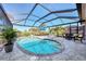 Inviting screened pool and patio area at 12953 N Marsh Dr, Port Charlotte, FL 33953