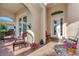 Relaxing covered porch with wicker furniture and potted plants at 12953 N Marsh Dr, Port Charlotte, FL 33953
