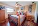 Main bedroom with wooden frame bed and hardwood floors at 145 Bunker Rd, Rotonda West, FL 33947
