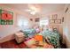 Guest bedroom with two twin beds and colorful bedding at 145 Bunker Rd, Rotonda West, FL 33947