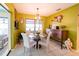 Charming dining room with glass-top table and four chairs at 145 Bunker Rd, Rotonda West, FL 33947