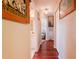 Long hallway with hardwood floors and access to bedrooms and bath at 145 Bunker Rd, Rotonda West, FL 33947