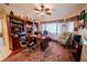 Bright home office with built-in shelves and hardwood floors at 145 Bunker Rd, Rotonda West, FL 33947