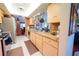 Well-equipped kitchen with granite countertops and ample cabinetry at 145 Bunker Rd, Rotonda West, FL 33947
