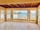 Sunroom with water views and tile floor at 1467 Deer Creek Dr, Englewood, FL 34223