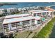 Waterfront condo community with pool and lush landscaping at 1551 Beach Rd # 205, Englewood, FL 34223
