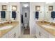 Double vanity bathroom with granite countertops and a shower at 1551 Beach Rd # 205, Englewood, FL 34223