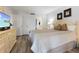 Bright bedroom with a queen-size bed and plenty of closet space at 1551 Beach Rd # 205, Englewood, FL 34223