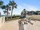 Private deck with lounge chairs and stunning water views at 1551 Beach Rd # 205, Englewood, FL 34223