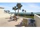 Spacious deck with lounge chairs, offering water views at 1551 Beach Rd # 205, Englewood, FL 34223