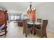 Dining area with glass-top table and wicker chairs at 1551 Beach Rd # 205, Englewood, FL 34223