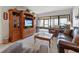 Relaxing living room with leather sofas, armchairs, and sliding doors leading to balcony at 1551 Beach Rd # 205, Englewood, FL 34223