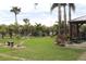 Landscaped backyard with stone pathway and gazebo at 170 Antilla Dr, Rotonda West, FL 33947