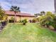 Large backyard with lush tropical landscaping and great lawn space at 170 Antilla Dr, Rotonda West, FL 33947