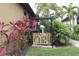 Private gated backyard access with lush plants at 170 Antilla Dr, Rotonda West, FL 33947