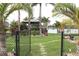 Landscaped backyard featuring a gazebo and stone pathway at 170 Antilla Dr, Rotonda West, FL 33947