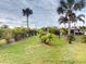 Expansive backyard showcasing lush tropical landscaping at 170 Antilla Dr, Rotonda West, FL 33947
