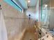 Large walk-in shower with built-in seat and tiled walls at 170 Antilla Dr, Rotonda West, FL 33947