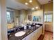 Elegant bathroom with double vanity and granite countertop at 170 Antilla Dr, Rotonda West, FL 33947