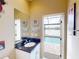 Bathroom with vanity, sink, and access to backyard pool at 170 Antilla Dr, Rotonda West, FL 33947